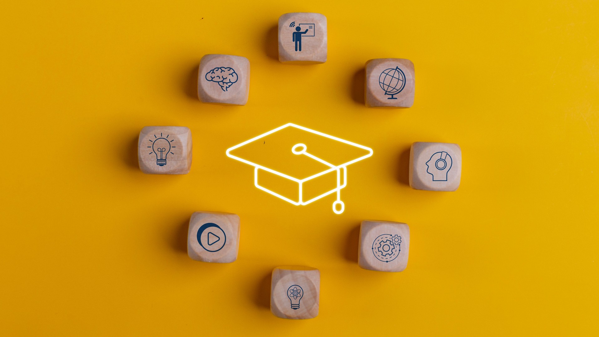 Knowledge and teaching. Wooden cubes with graduation and education symbols. Success and necessary skills in graduation or education.